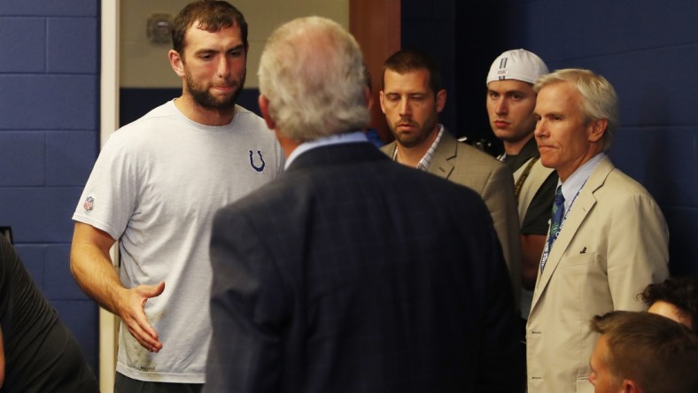 Aug 24, 2019; Indianapolis, IN, USA; Indianapolis Colts quarterback Andrew Luck says goodbye to Colts owner Jim Irsay after announcing his retirement in a press conference after the game against the Chicago Bears at Lucas Oil Stadium. Mandatory Credit: Brian Spurlock-USA TODAY Sports