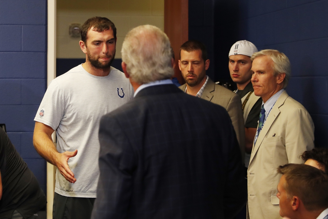 Aug 24, 2019; Indianapolis, IN, USA; Indianapolis Colts quarterback Andrew Luck says goodbye to Colts owner Jim Irsay after announcing his retirement in a press conference after the game against the Chicago Bears at Lucas Oil Stadium. Mandatory Credit: Brian Spurlock-USA TODAY Sports