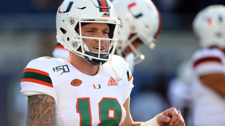 Aug 24, 2019; Orlando, FL, USA; Miami Hurricanes quarterback Tate Martell (18) works out prior to the game at Camping World Stadium. Mandatory Credit: Kim Klement-USA TODAY Sports