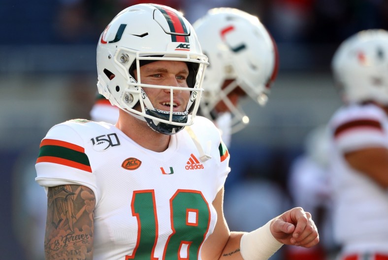 Aug 24, 2019; Orlando, FL, USA; Miami Hurricanes quarterback Tate Martell (18) works out prior to the game at Camping World Stadium. Mandatory Credit: Kim Klement-USA TODAY Sports
