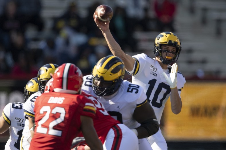 Nov 2, 2019; College Park, MD, USA;  Michigan Wolverines quarterback Dylan McCaffrey (10) throws during the fourth quarter against the Maryland Terrapins at Capital One Field at Maryland Stadium. Mandatory Credit: Tommy Gilligan-USA TODAY Sports