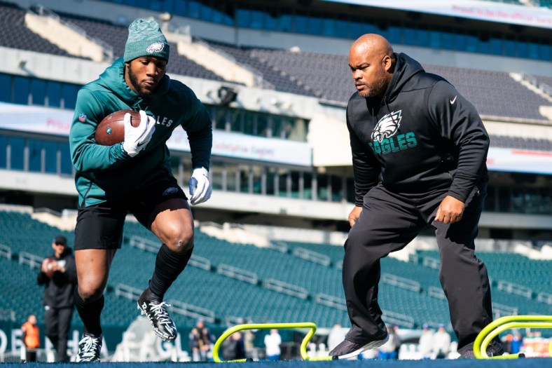 Nov 3, 2019; Philadelphia, PA, USA; Philadelphia Eagles running back Miles Sanders (L) warms up in front of assistant coach Duce Staley (R) before a game against the Chicago Bears at Lincoln Financial Field. Mandatory Credit: Bill Streicher-USA TODAY Sports