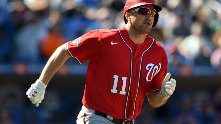Mar 1, 2020; Port St. Lucie, Florida, USA; Washington Nationals infielder Ryan Zimmerman (11) doubles against the New York Mets in the fourth inning at Clover Park. Mandatory Credit: Jim Rassol-USA TODAY Sports