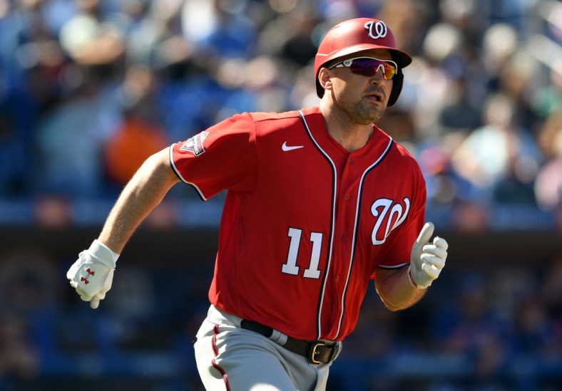 Mar 1, 2020; Port St. Lucie, Florida, USA; Washington Nationals infielder Ryan Zimmerman (11) doubles against the New York Mets in the fourth inning at Clover Park. Mandatory Credit: Jim Rassol-USA TODAY Sports