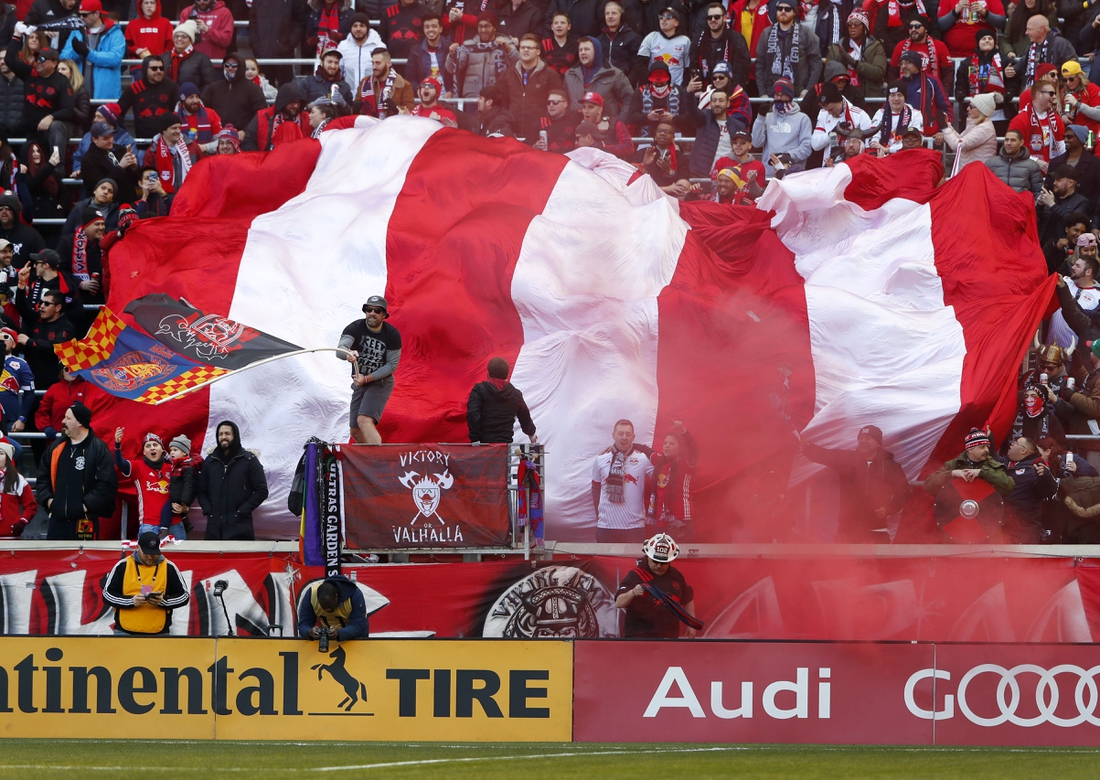 Mar 1, 2020; Harrison, New Jersey, USA;  New York Red Bulls fans celebrate after a goal against FC Cincinnati during the first half at Red Bull Arena. Mandatory Credit: Noah K. Murray-USA TODAY Sports