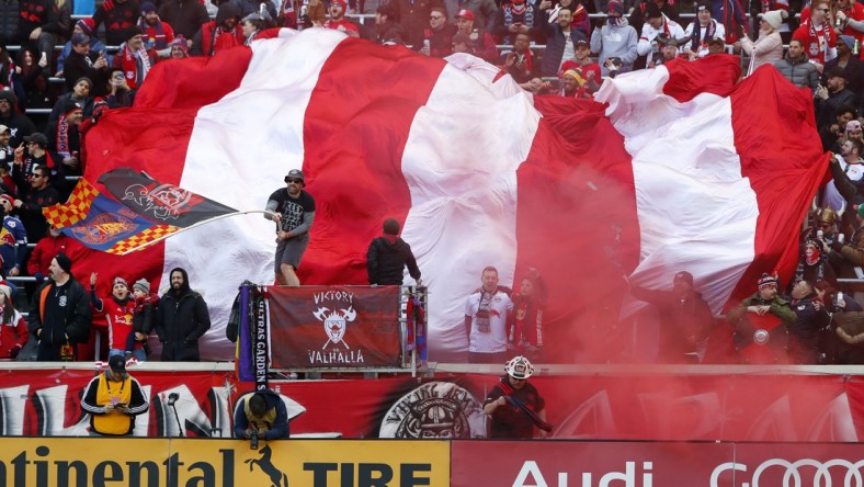 Mar 1, 2020; Harrison, New Jersey, USA;  New York Red Bulls fans celebrate after a goal against FC Cincinnati during the first half at Red Bull Arena. Mandatory Credit: Noah K. Murray-USA TODAY Sports