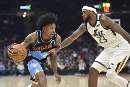 Mar 2, 2020; Cleveland, Ohio, USA; Cleveland Cavaliers guard Kevin Porter Jr. (4) drives against Utah Jazz forward Royce O'Neale (23) in the second quarter at Rocket Mortgage FieldHouse. Mandatory Credit: David Richard-USA TODAY Sports