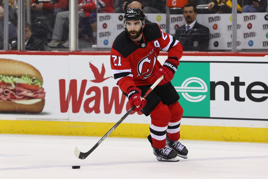 Mar 10, 2020; Newark, New Jersey, USA; New Jersey Devils right wing Kyle Palmieri (21) skates with the puck against the Pittsburgh Penguins during the second period at Prudential Center. Mandatory Credit: Ed Mulholland-USA TODAY Sports