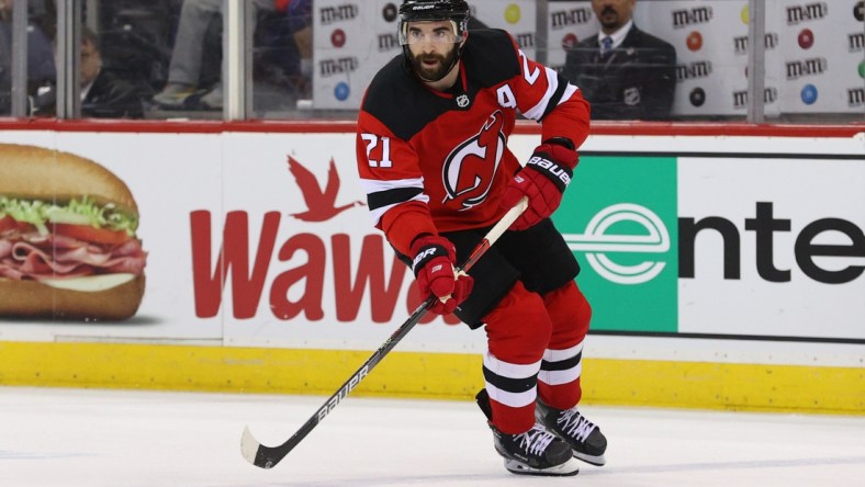 Mar 10, 2020; Newark, New Jersey, USA; New Jersey Devils right wing Kyle Palmieri (21) skates with the puck against the Pittsburgh Penguins during the second period at Prudential Center. Mandatory Credit: Ed Mulholland-USA TODAY Sports