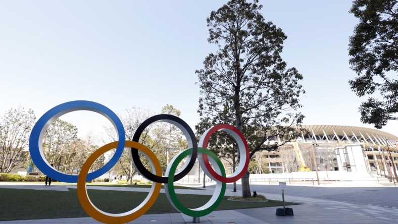 Mar 24, 2020; Tokyo, Japan; Olympic rings monument in front of National Stadium. On Monday the IOC announced that the Tokyo 2020 Summer Olympics Games would be postponed due to the COVID-19 coronavirus pandemic. Mandatory Credit: Yukihito Taguchi-USA TODAY Sports