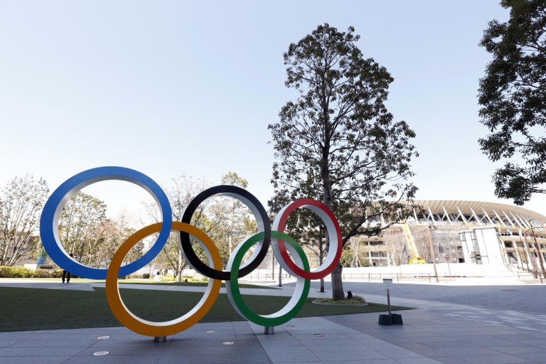 Mar 24, 2020; Tokyo, Japan; Olympic rings monument in front of National Stadium. On Monday the IOC announced that the Tokyo 2020 Summer Olympics Games would be postponed due to the COVID-19 coronavirus pandemic. Mandatory Credit: Yukihito Taguchi-USA TODAY Sports
