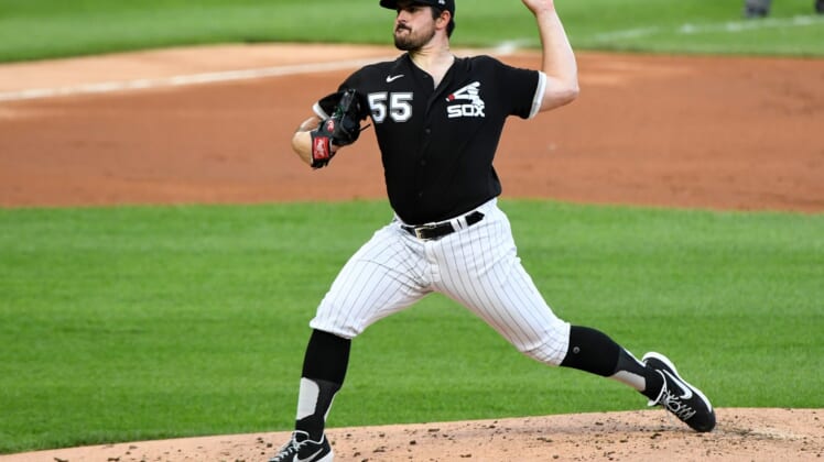 Jul 22, 2020; Chicago, Illinois, USA; Chicago White Sox starting pitcher Carlos Rodon (55) throws a pitch against the Milwaukee Brewers during the second inning at Guaranteed Rate Field. Mandatory Credit: Mike Dinovo-USA TODAY Sports