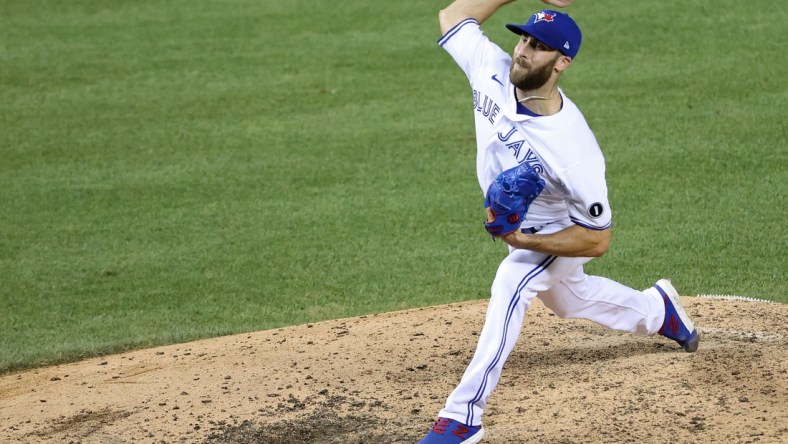 Jul 29, 2020; Washington, DC, USA; Toronto Blue Jays relief pitcher Anthony Bass (52) pitches against the Washington Nationals in the ninth inning at Nationals Park. Mandatory Credit: Geoff Burke-USA TODAY Sports