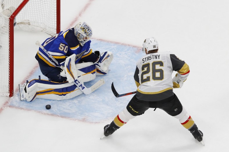 Aug 6, 2020; Edmonton, Alberta, CAN; St. Louis Blues goaltender Jordan Binnington (50) makes a save on Vegas Golden Knights forward Paul Stastny (26) during the third period of the Western Conference qualifications at Rogers Place. Mandatory Credit: Perry Nelson-USA TODAY Sports