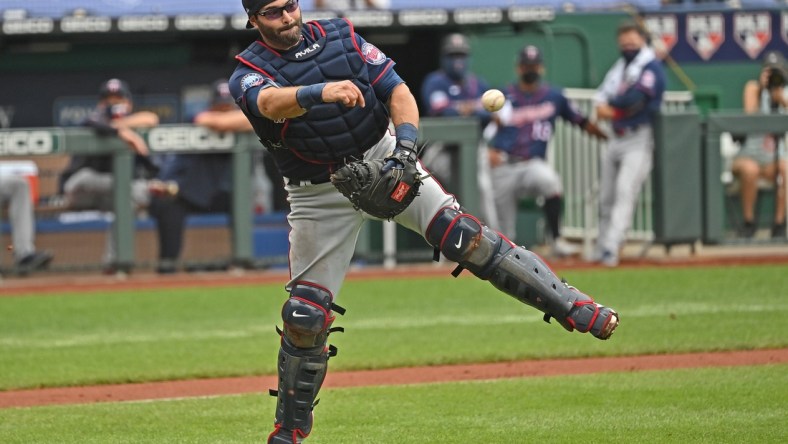 Aug 9, 2020; Kansas City, Missouri, USA; Minnesota Twins catcher Alex Avila (16) throws to first for a out during the third inning against the Kansas City Royals at Kauffman Stadium. Mandatory Credit: Peter Aiken-USA TODAY Sports