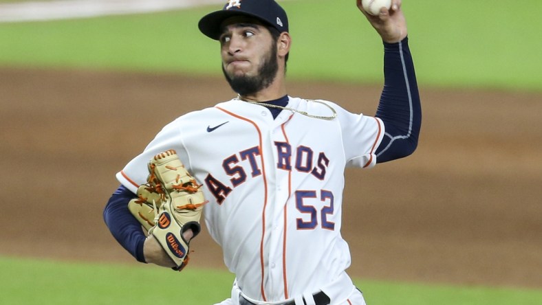 Aug 24, 2020; Houston, Texas, USA; Houston Astros relief pitcher Cionel Perez (52) pitches against the Los Angeles Angels in the ninth inning at Minute Maid Park. Mandatory Credit: Thomas Shea-USA TODAY Sports