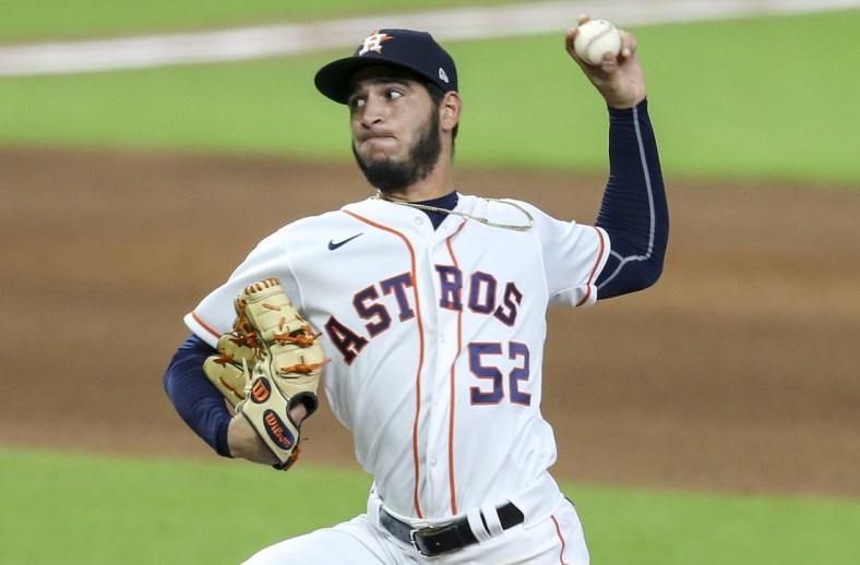 Aug 24, 2020; Houston, Texas, USA; Houston Astros relief pitcher Cionel Perez (52) pitches against the Los Angeles Angels in the ninth inning at Minute Maid Park. Mandatory Credit: Thomas Shea-USA TODAY Sports