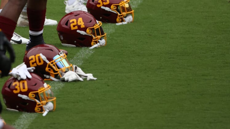 Aug 31, 2020; Washington, DC, United States; Washington Football Team players  helmets rest on the field during a practice at Fedex Field. Mandatory Credit: Geoff Burke-USA TODAY Sports