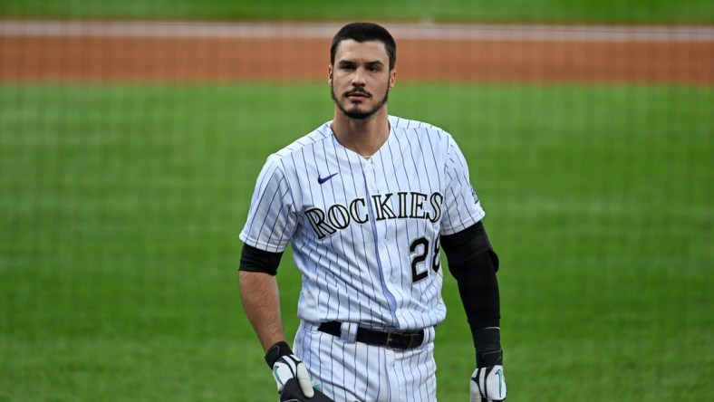 Sep 12, 2020; Denver, Colorado, USA; Colorado Rockies third baseman Nolan Arenado (28) reacts following his strikeout in the first inning against the Los Angeles Angels at Coors Field. Mandatory Credit: Ron Chenoy-USA TODAY Sports