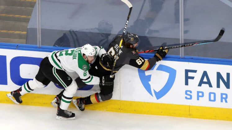 Sep 14, 2020; Edmonton, Alberta, CAN; Dallas Stars defenseman Jamie Oleksiak (2) checks Vegas Golden Knights right wing Mark Stone (61) during the second period in game five of the second round of the 2020 Stanley Cup Playoffs at Rogers Place. Mandatory Credit: Gerry Thomas-USA TODAY Sports