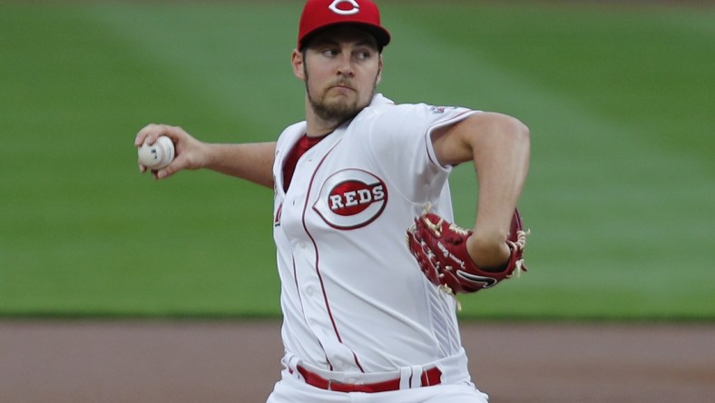 Sep 23, 2020; Cincinnati, Ohio, USA; Cincinnati Reds starting pitcher Trevor Bauer (27) throws against the Milwaukee Brewers during the first inning at Great American Ball Park. Mandatory Credit: David Kohl-USA TODAY Sports