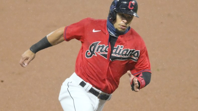 Sep 30, 2020; Cleveland, Ohio, USA; Cleveland Indians second baseman Cesar Hernandez (7) rounds third base while scoring in the first inning against the New York Yankees at Progressive Field. Mandatory Credit: David Richard-USA TODAY Sports