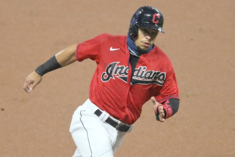 Sep 30, 2020; Cleveland, Ohio, USA; Cleveland Indians second baseman Cesar Hernandez (7) rounds third base while scoring in the first inning against the New York Yankees at Progressive Field. Mandatory Credit: David Richard-USA TODAY Sports