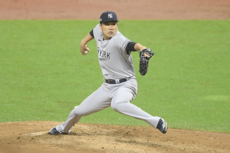 Sep 30, 2020; Cleveland, Ohio, USA; New York Yankees starting pitcher Masahiro Tanaka (19) delivers in the third inning against the Cleveland Indians at Progressive Field. Mandatory Credit: David Richard-USA TODAY Sports