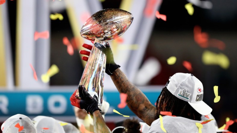 Feb 2, 2020; Miami Gardens, Florida, USA; Detailed view of the Vince Lombardi Trophy in the hands of a Kansas City Chiefs player celebrating after defeating the San Francisco 49ers in Super Bowl LIV at Hard Rock Stadium. Mandatory Credit: Mark J. Rebilas-USA TODAY Sports