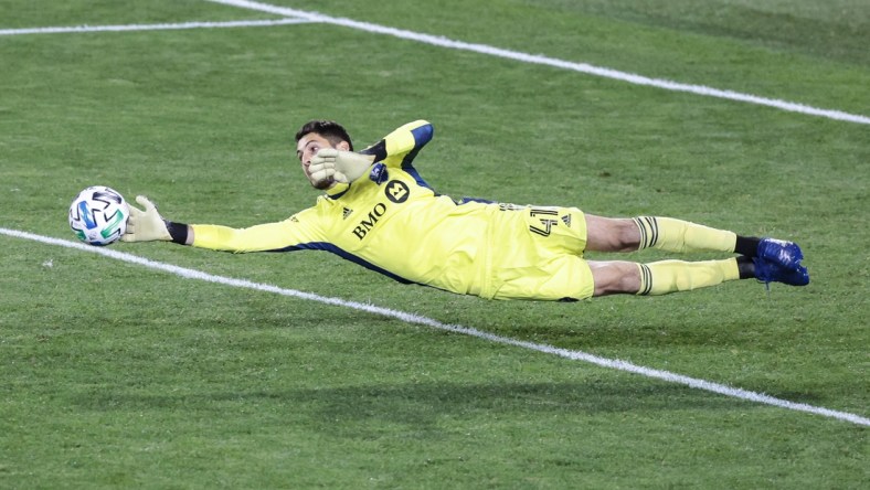 Oct 17, 2020; Harrison, New Jersey, USA; Montreal Impact goalkeeper James Pantemis (41) makes a diving save during the second half Inter Miami at Red Bull Arena. Mandatory Credit: Vincent Carchietta-USA TODAY Sports