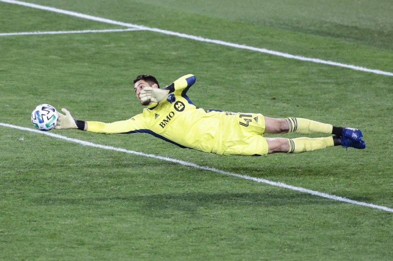 Oct 17, 2020; Harrison, New Jersey, USA; Montreal Impact goalkeeper James Pantemis (41) makes a diving save during the second half Inter Miami at Red Bull Arena. Mandatory Credit: Vincent Carchietta-USA TODAY Sports
