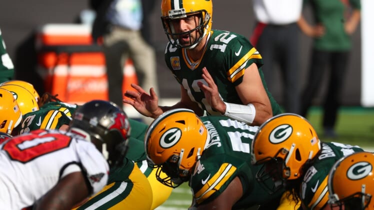 Oct 18, 2020; Tampa, Florida, USA; Green Bay Packers quarterback Aaron Rodgers (12) calls a play against the Tampa Bay Buccaneers during the first quarter of a NFL game at Raymond James Stadium. Mandatory Credit: Kim Klement-USA TODAY Sports