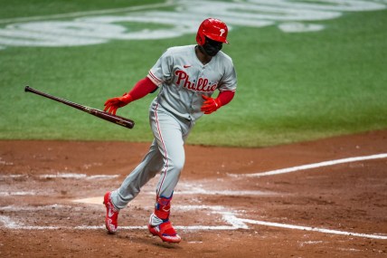 Sep 26, 2020; St. Petersburg, Florida, USA; Philadelphia Phillies shortstop Didi Gregorius (18) flips his bat as he runs to first base during a game against the Tampa Bay Rays at Tropicana Field. Mandatory Credit: Mary Holt-USA TODAY Sports