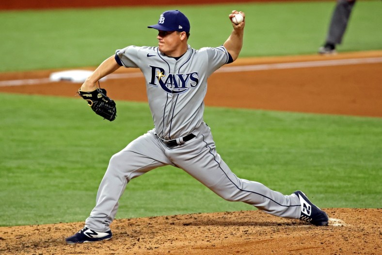 Oct 27, 2020; Arlington, Texas, USA;  Tampa Bay Rays relief pitcher Aaron Loup (15) pitches during the sixth inning against the Los Angeles Dodgers during game six of the 2020 World Series at Globe Life Field. Mandatory Credit: Tim Heitman-USA TODAY Sports