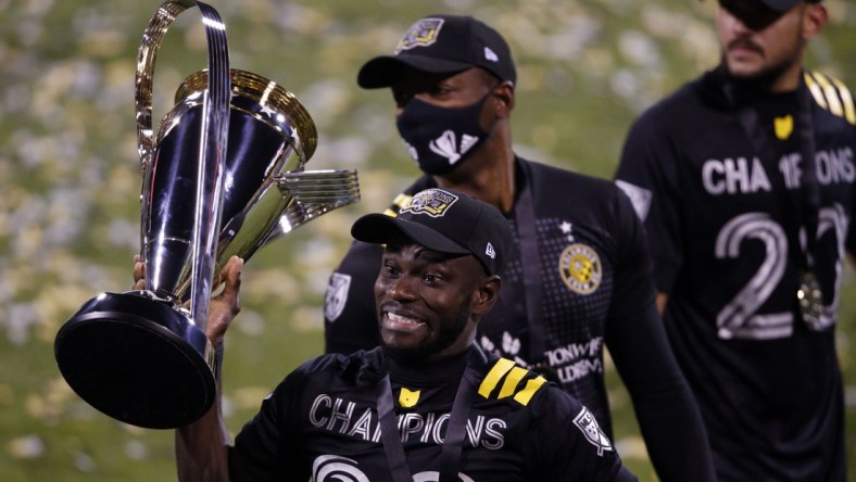 Dec 12, 2020; Columbus, Ohio, USA; Columbus Crew defender Jonathan Mensah (4) celebrates their 3-0 win over the Seattle Sounders in the MLS Cup at MAPFRE Stadium. Mandatory Credit: Joseph Maiorana-USA TODAY Sports