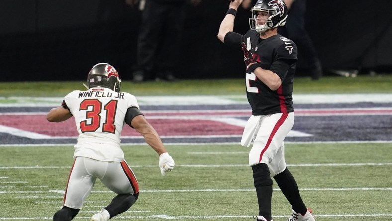 Dec 20, 2020; Atlanta, Georgia, USA; Atlanta Falcons quarterback Matt Ryan (2) throws a pass against Tampa Bay Buccaneers strong safety Antoine Winfield Jr. (31) in the first half of a NFL game at Mercedes-Benz Stadium. Mandatory Credit: Dale Zanine-USA TODAY Sports