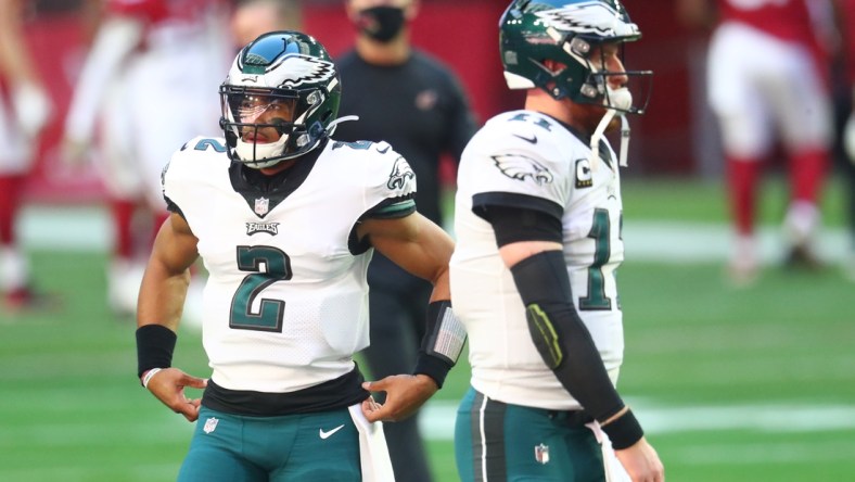 Dec 20, 2020; Glendale, Arizona, USA; Philadelphia Eagles quarterback Jalen Hurts (2) and Carson Wentz (11) against the Arizona Cardinals at State Farm Stadium. Mandatory Credit: Mark J. Rebilas-USA TODAY Sports