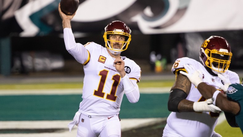 Jan 3, 2021; Philadelphia, Pennsylvania, USA; Washington Football Team quarterback Alex Smith (11) passes the ball against the Philadelphia Eagles during the first quarter at Lincoln Financial Field. Mandatory Credit: Bill Streicher-USA TODAY Sports