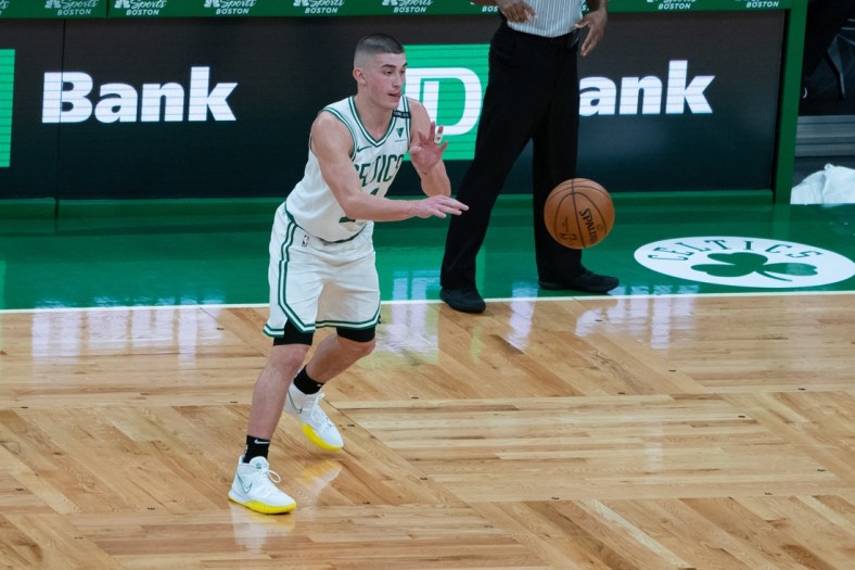 Dec 30, 2020; Boston, Massachusetts, USA; Boston Celtics point guard Payton Pritchard (11) passes the ball during the second quarter against the Memphis Grizzlies at TD Garden. Mandatory Credit: Gregory Fisher-USA TODAY Sports