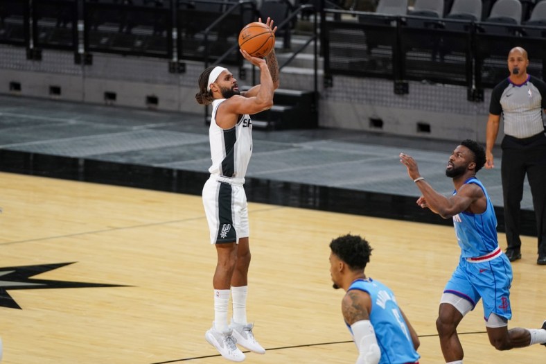 Jan 16, 2021; San Antonio, Texas, USA;  San Antonio Spurs guard Patty Mills (8) shoots in the first half against the Houston Rockets at the AT&T Center. Mandatory Credit: Daniel Dunn-USA TODAY Sports
