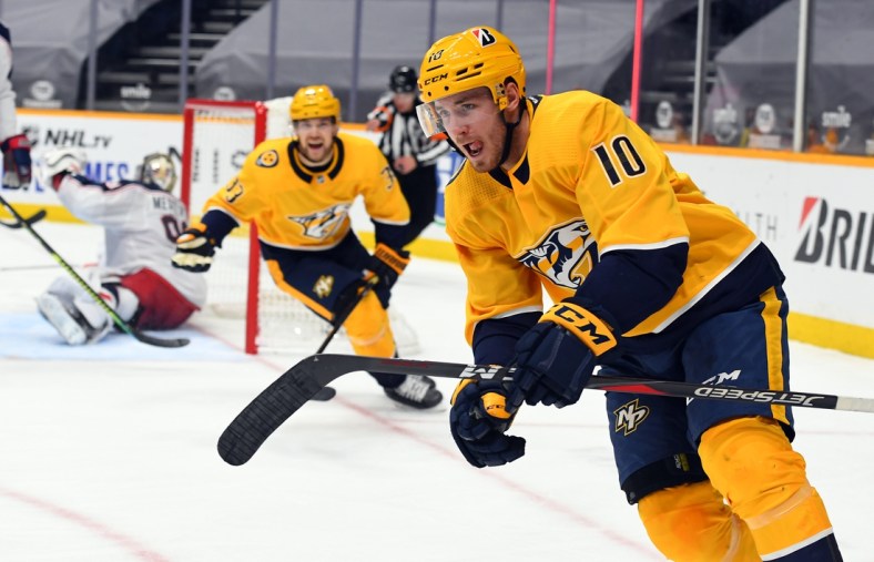 Jan 16, 2021; Nashville, Tennessee, USA; Nashville Predators center Colton Sissons (10) and right wing Viktor Arvidsson (33) celebrate after a goal against the Columbus Blue Jackets during the third period at Bridgestone Arena. Mandatory Credit: Christopher Hanewinckel-USA TODAY Sports