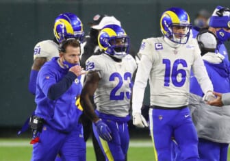 Jan 16, 2021; Green Bay, Wisconsin, USA; Los Angeles Rams head coach Sean McVay with running back Cam Akers (23) and quarterback Jared Goff (16) against Green Bay Packers during the NFC Divisional Round at Lambeau Field. Mandatory Credit: Mark J. Rebilas-USA TODAY Sports
