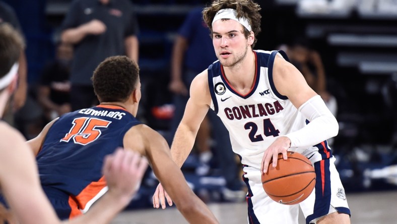 Jan 14, 2021; Spokane, Washington, USA; Gonzaga Bulldogs forward Corey Kispert (24) brings the ball down court against Pepperdine Waves forward Kessler Edwards (15) in the second half of a WCC men   s basketball game at McCarthey Athletic Center. The Bulldogs won 95-70. Mandatory Credit: James Snook-USA TODAY Sports