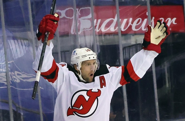 Jan 19, 2021; New York, New York, USA; New Jersey Devils center Travis Zajac (19) celebrates after scoring a goal against the New York Rangers at 32 seconds of the first period at Madison Square Garden. Mandatory Credit:  Bruce Bennett/Pool Photos-USA TODAY Sports