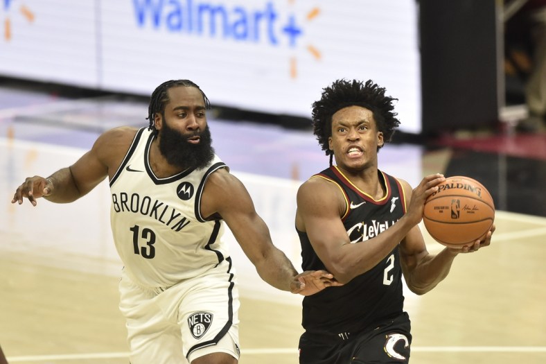 Jan 20, 2021; Cleveland, Ohio, USA; Cleveland Cavaliers guard Collin Sexton (2) drives against Brooklyn Nets guard James Harden (13) in the second overtime at Rocket Mortgage FieldHouse. Mandatory Credit: David Richard-USA TODAY Sports
