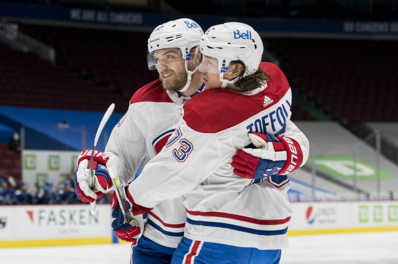 Jan 20, 2021; Vancouver, British Columbia, CAN; Montreal Canadiens forward Joel Armia (40) and forward Tyler Toffoli (73) celebrate Toffoli   s first goal against the Vancouver Canucks in the second period during a game at Rogers Arena. Mandatory Credit: Bob Frid-USA TODAY Sports