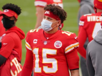 Jan 17, 2021; Kansas City, Missouri, USA; Kansas City Chiefs quarterback Patrick Mahomes (15) watches play on the sidelines during the AFC Divisional Round playoff game against the Cleveland Browns at Arrowhead Stadium. Mandatory Credit: Denny Medley-USA TODAY Sports