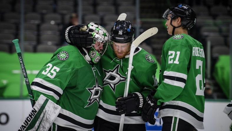 Jan 22, 2021; Dallas, Texas, USA; Dallas Stars goaltender Anton Khudobin (35) and center Joe Pavelski (16) and left wing Jason Robertson (21) celebrate the win over the Nashville Predators at the American Airlines Center. Mandatory Credit: Jerome Miron-USA TODAY Sports