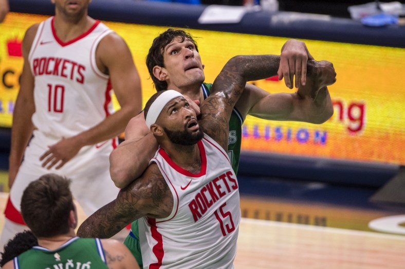 Jan 23, 2021; Dallas, Texas, USA; Houston Rockets center DeMarcus Cousins (15) and Dallas Mavericks center Boban Marjanovic (51) fight for position during the first quarter at the American Airlines Center. Mandatory Credit: Jerome Miron-USA TODAY Sports
