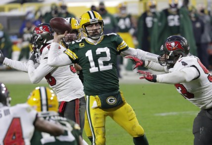 Jan 24, 2021, Green Bay, WI, USA; Green Bay Packers quarterback Aaron Rodgers (12) throws an inccomplete pass against Tampa Bay Buccaneers defensive end Ndamukong Suh (93) in the final minutes of the game during the NFC championship game Sunday, January 24, 2021, at Lambeau Field Mandatory credit: Dan Powers / Milwaukee Journal Sentinel via USA TODAY NETWORK